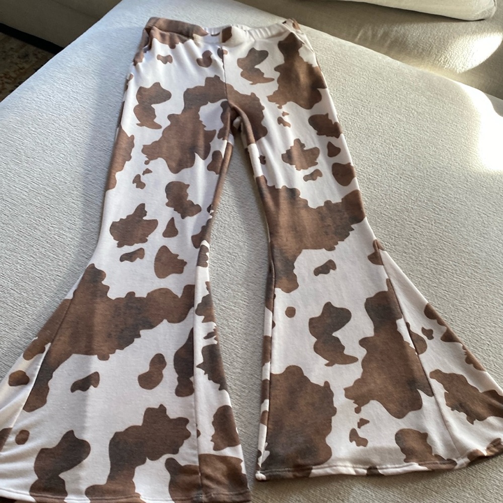 Cow print bellbottoms.
